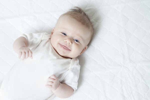 Smiling baby in a crib